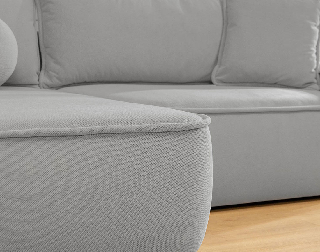 Canapé d'angle réversible 4 places convertible avec coffre en tissu texturé Enma