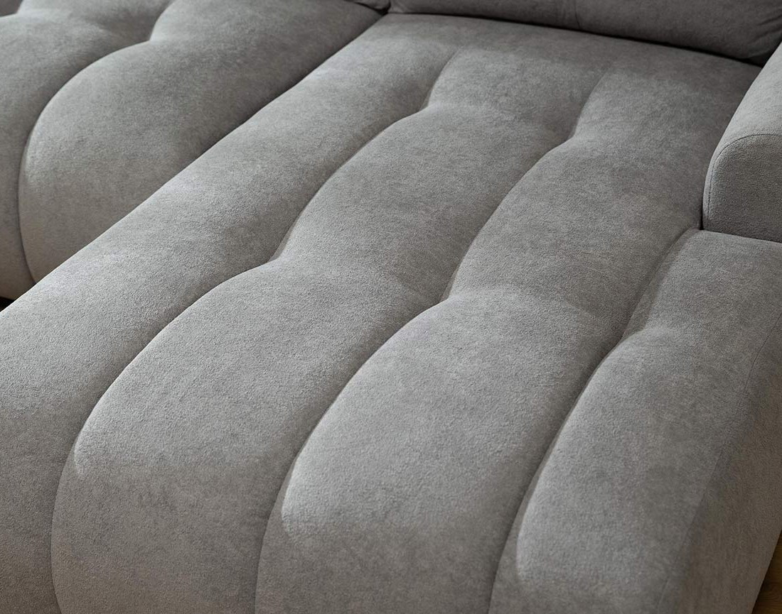 Canapé d'angle droit 4 places convertible avec coffre en tissu texturé Luzzio
