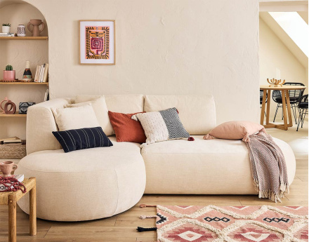 Canapé modulable d'angle gauche 4 places avec pouf en tissu texturé Santorini