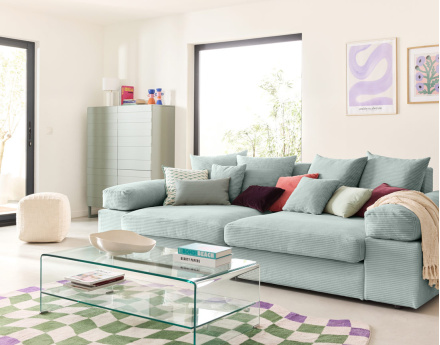 Canapé 4 places avec une assise profonde en velours côtelé