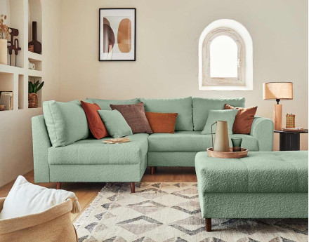 Canapé d'angle gauche 4 places avec pouf d'appoint en tissu bouclette Rune