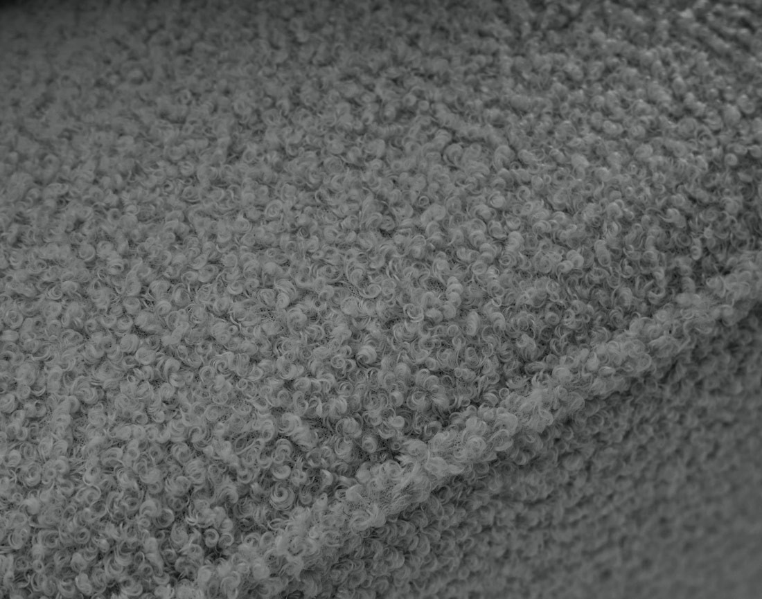 Canapé d'angle 4 places convertible avec coffre en tissu bouclette Topaze