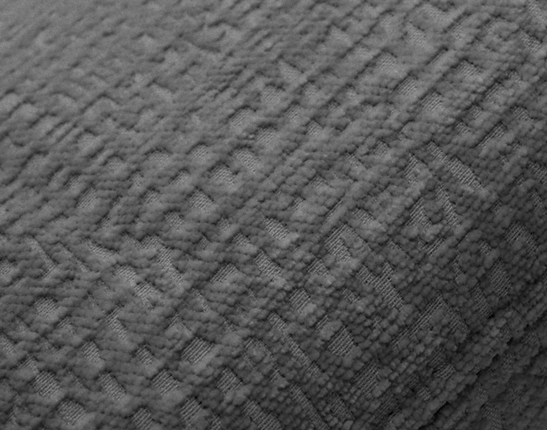 Pouf en tissu velours relief Bastille