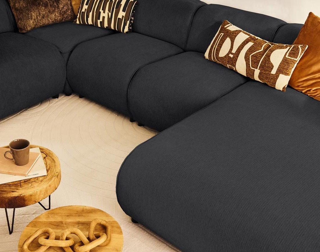 Canapé modulable panoramique d'angle gauche 7 places en tissu texturé Suaro