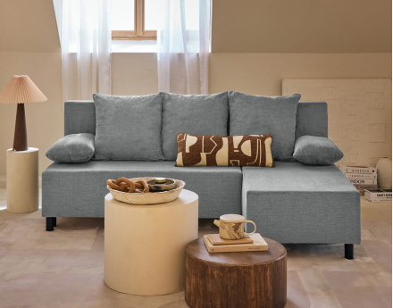 Canapé d'angle réversible 4 places convertible avec coffre en tissu texturé Gloria
